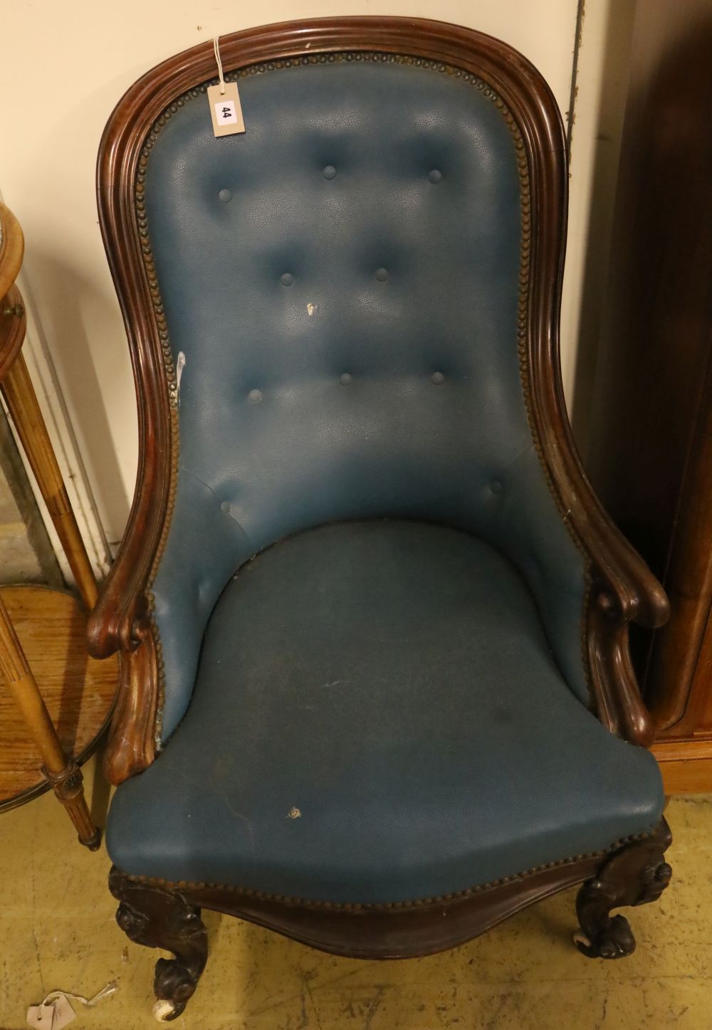 A Victorian mahogany spoonback armchair